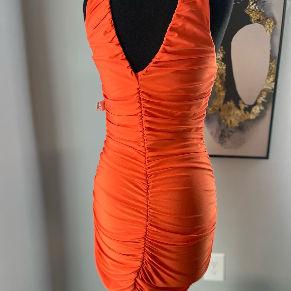 Orange Ruched knee length dress. Never worn.